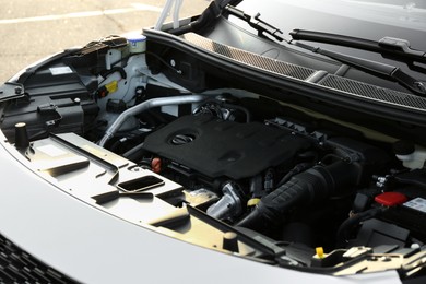 Photo of Closeup view of car engine in modern auto