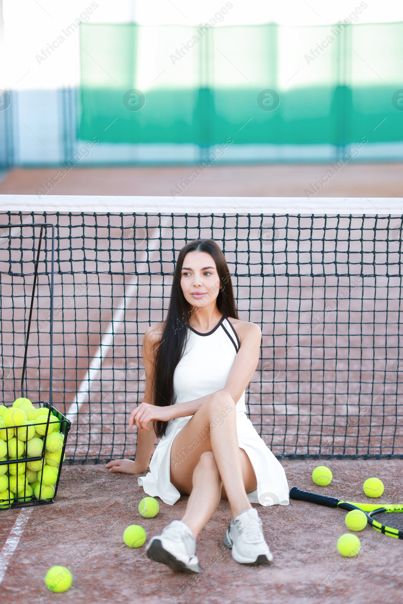 Photo of Beautiful woman in sportswear on tennis court