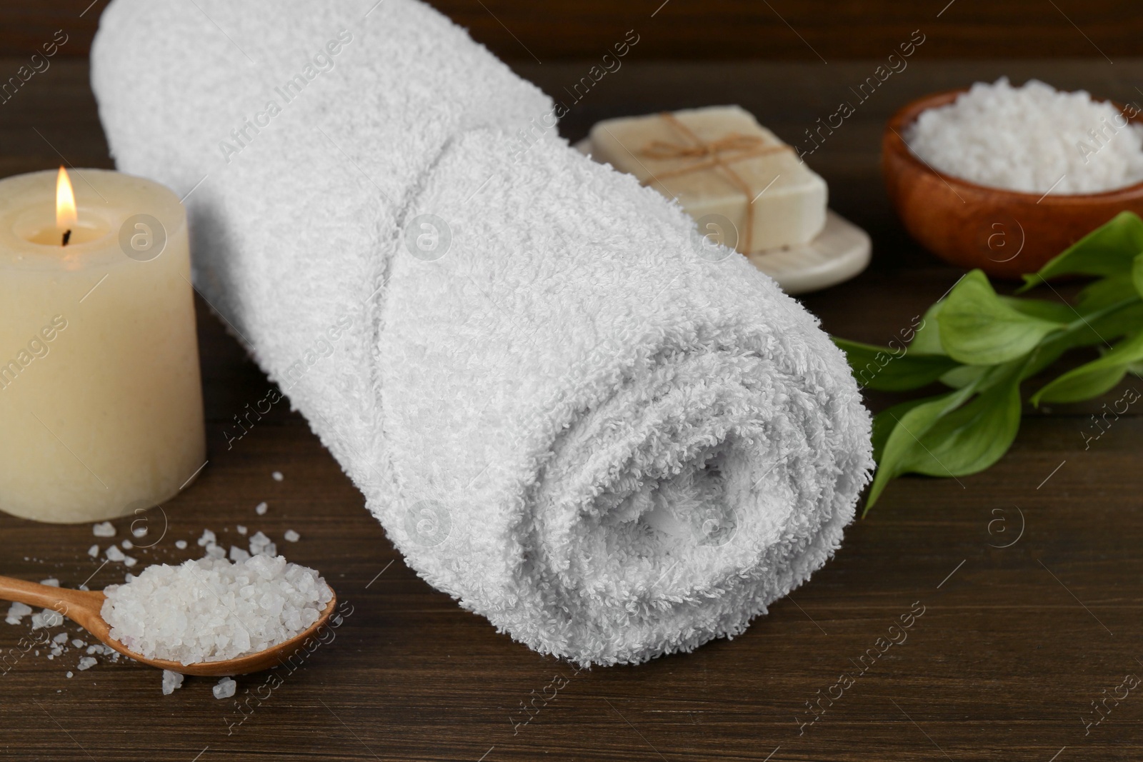 Photo of Composition with different spa supplies on wooden table, closeup