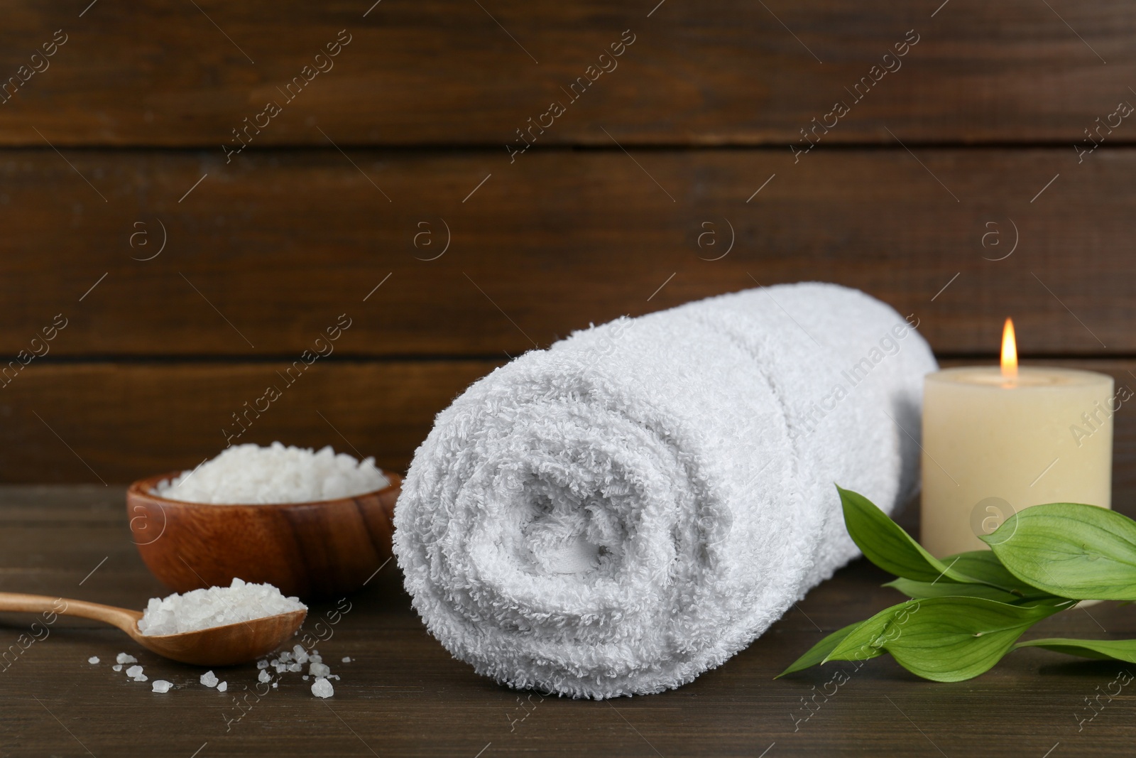 Photo of Composition with different spa supplies on wooden table