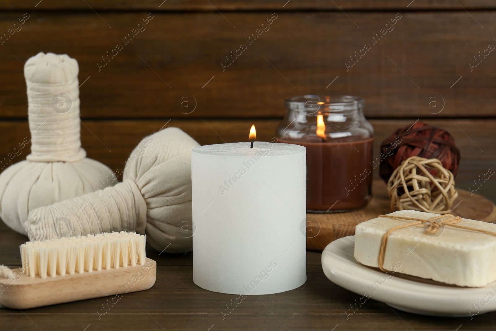 Photo of Composition with different spa supplies on wooden table