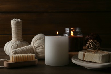 Photo of Composition with different spa supplies on wooden table