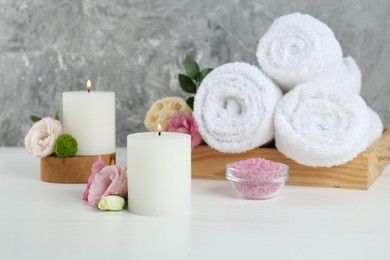 Photo of Composition with different spa supplies on white table