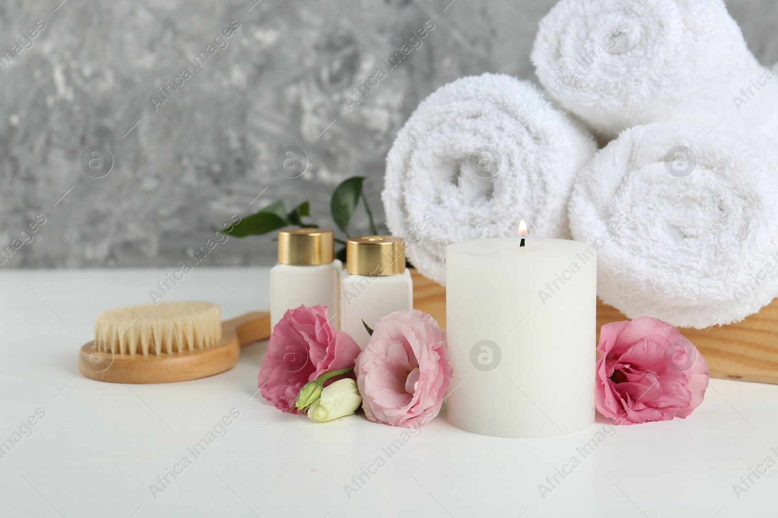 Photo of Composition with different spa supplies on white table