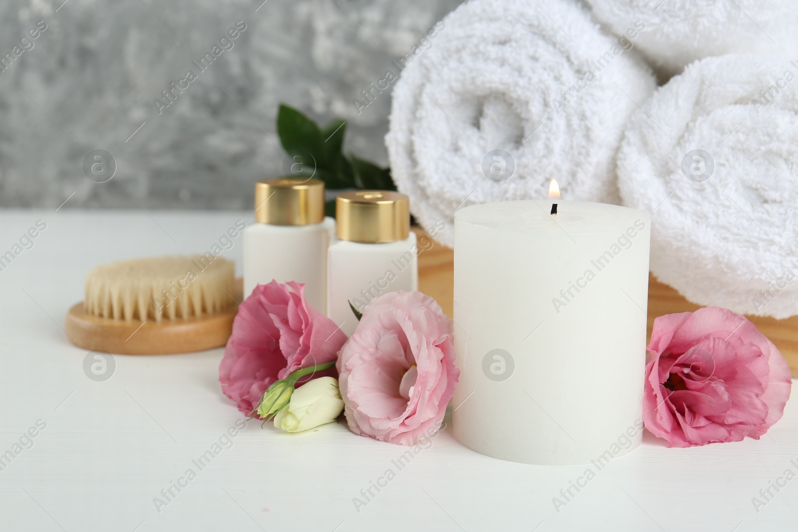 Photo of Composition with different spa supplies on white table, closeup