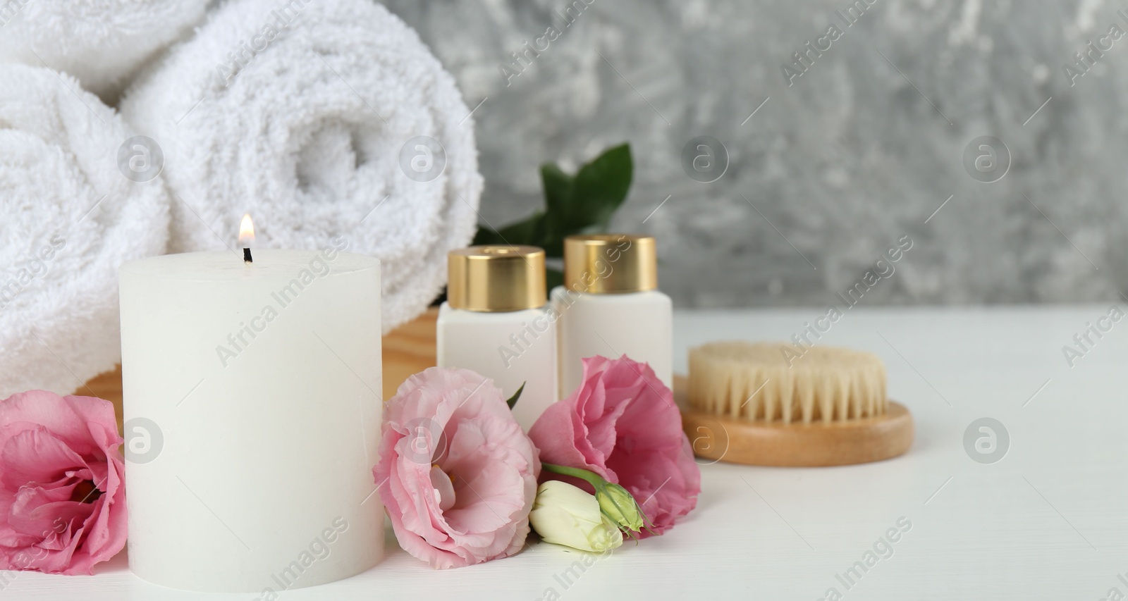 Photo of Composition with different spa supplies on white table, closeup