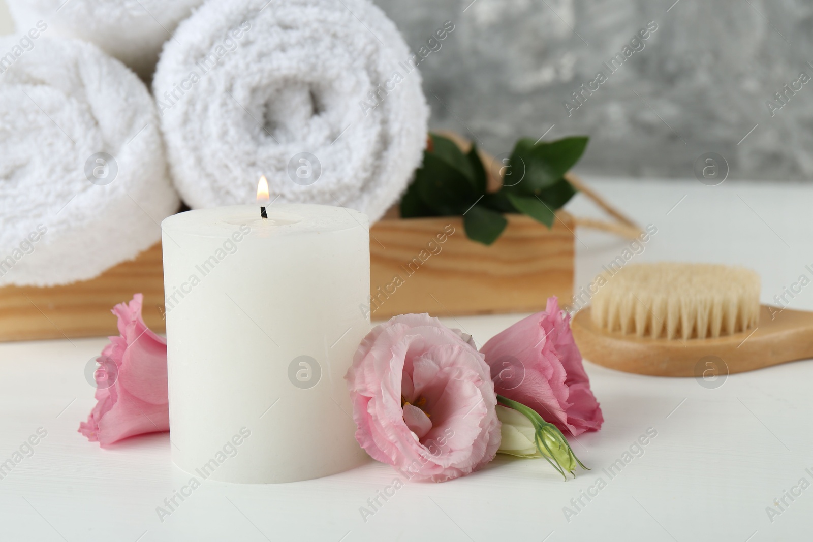 Photo of Composition with different spa supplies on white table, closeup