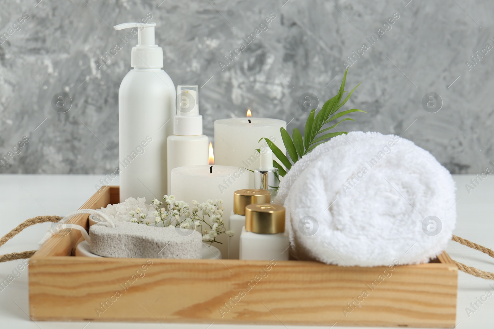 Photo of Composition with different spa supplies on white table