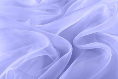 Beautiful blue violet tulle fabric as background, closeup