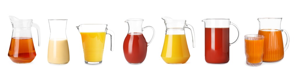 Image of Glass jugs with different juices isolated on white, set