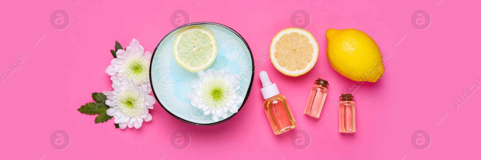 Image of Flat lay composition with bowl of water, flowers and lemons on pink background, banner design. Spa treatment