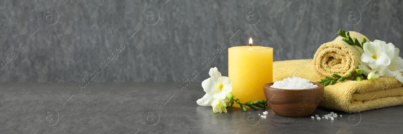 Image of Composition with sea salt and towels for spa treatment on table, banner design. Space for text