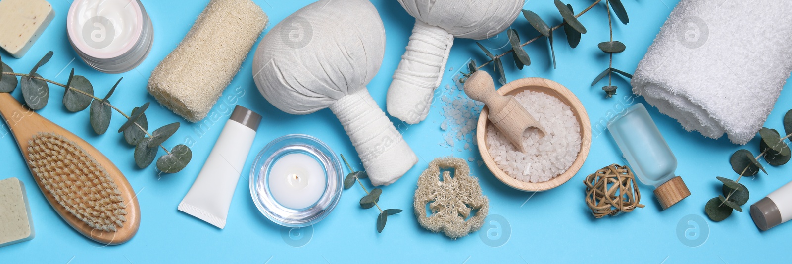 Image of Flat lay composition with cosmetic products for spa treatment on light blue background, banner design