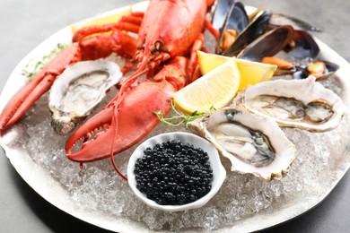 Photo of Different sea food on grey table, closeup