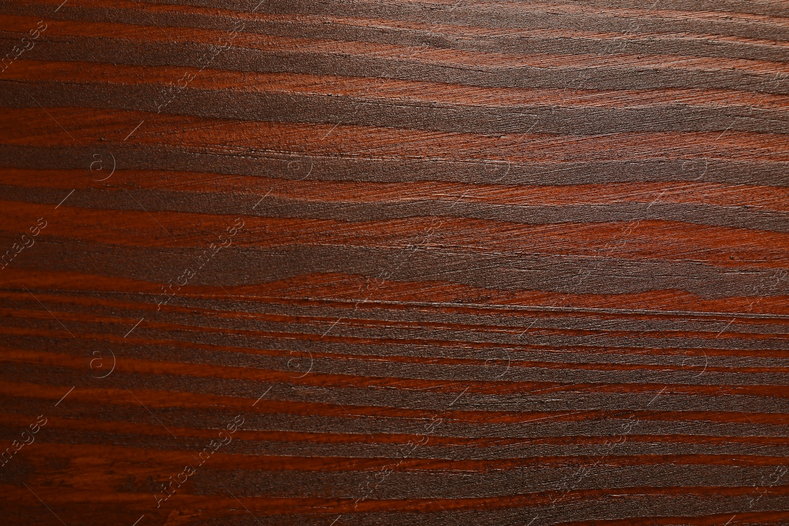 Photo of Texture of wooden surface after applying walnut wood stain as background, top view