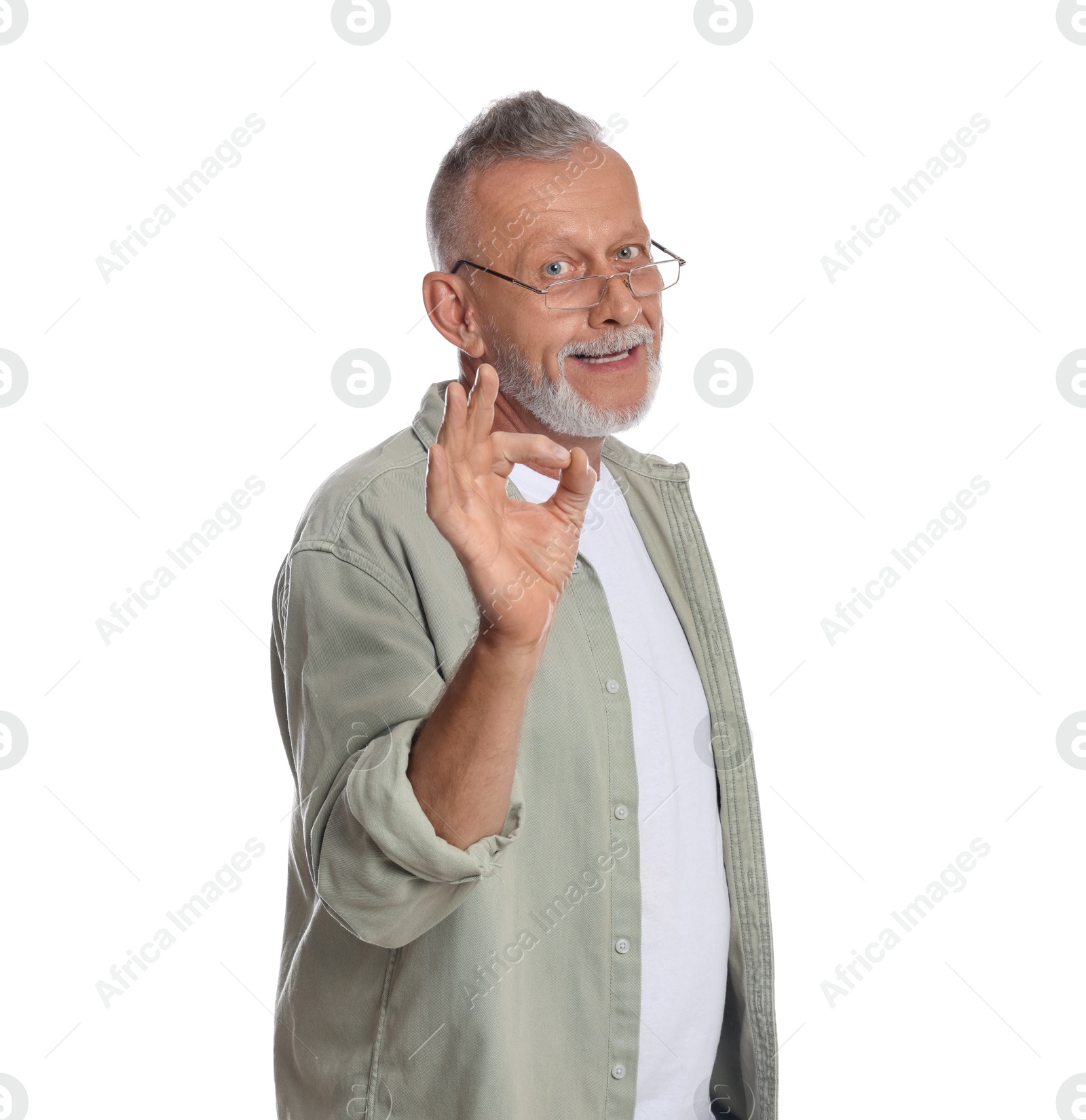 Photo of Portrait of handsome senior man showing ok gesture on white background