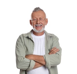 Photo of Portrait of smiling senior man with crossed arms on white background