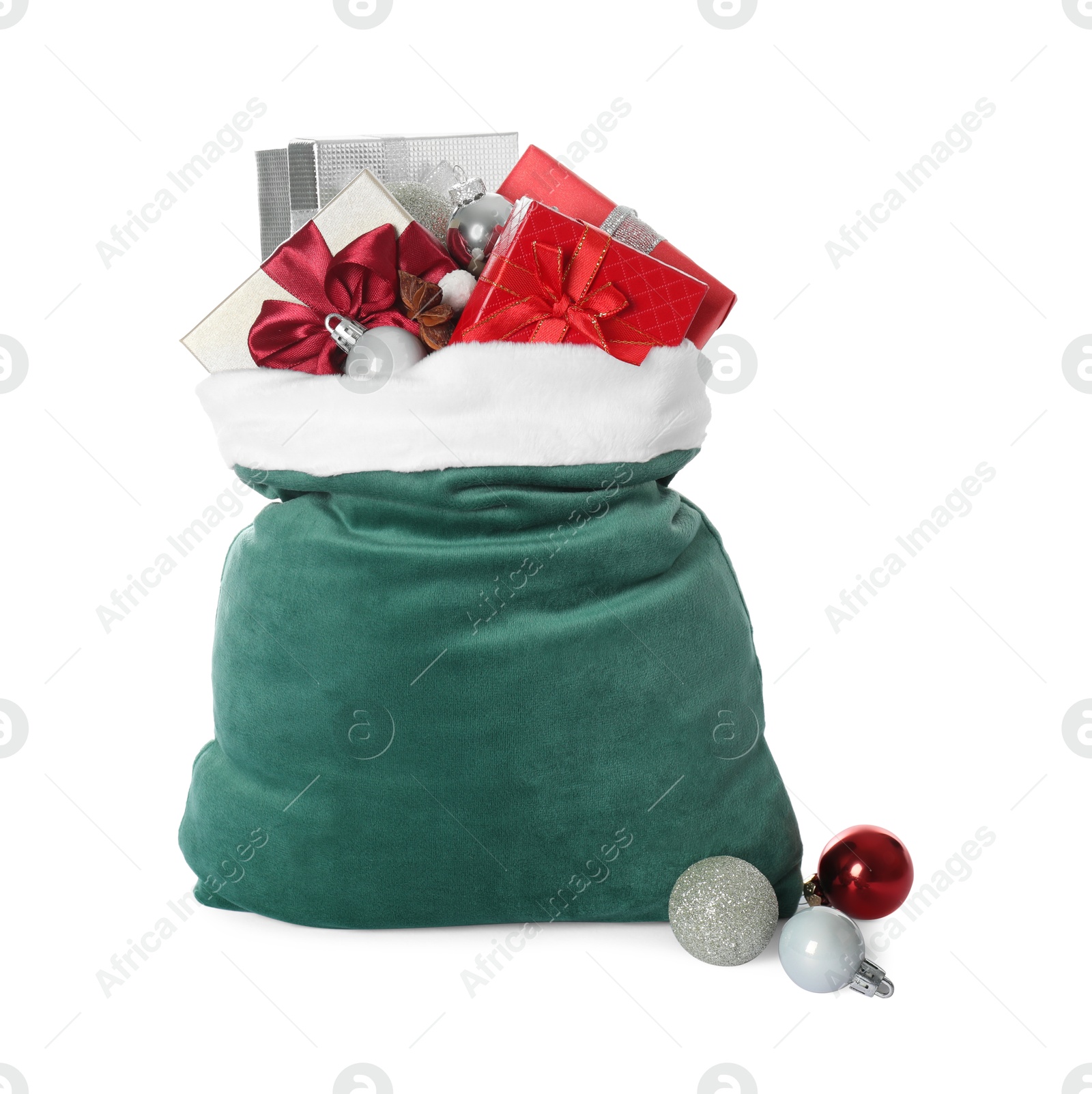 Photo of Santa Claus bag with gift boxes and Christmas balls isolated on white