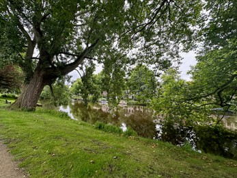 Photo of Picturesque view of canal and trees outdoors