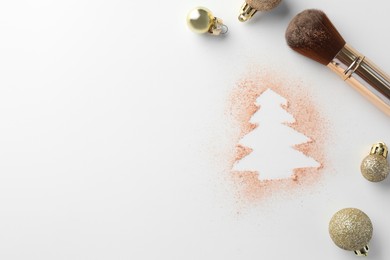 Photo of Christmas tree made of powder, balls and makeup brush on white background, flat lay. Space for text