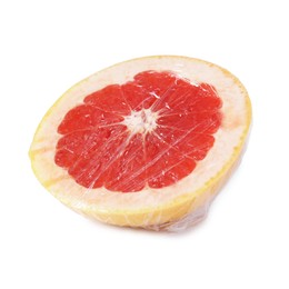 Photo of Half of grapefruit with plastic food wrap isolated on white