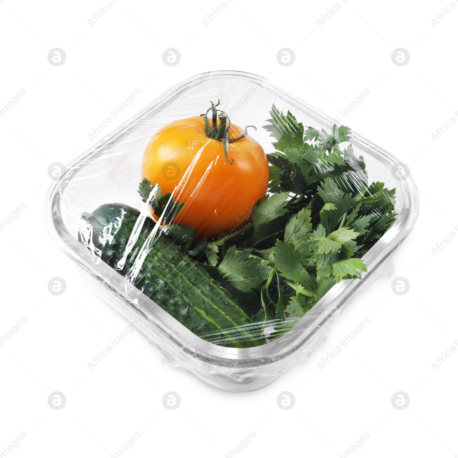 Photo of Glass container of fresh vegetables with plastic food wrap isolated on white