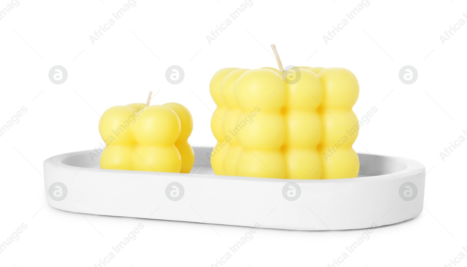 Photo of Two yellow bubble candles isolated on white