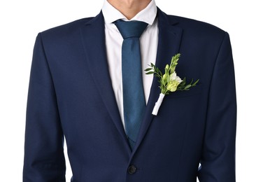 Photo of Groom in suit with stylish boutonniere on white background, closeup