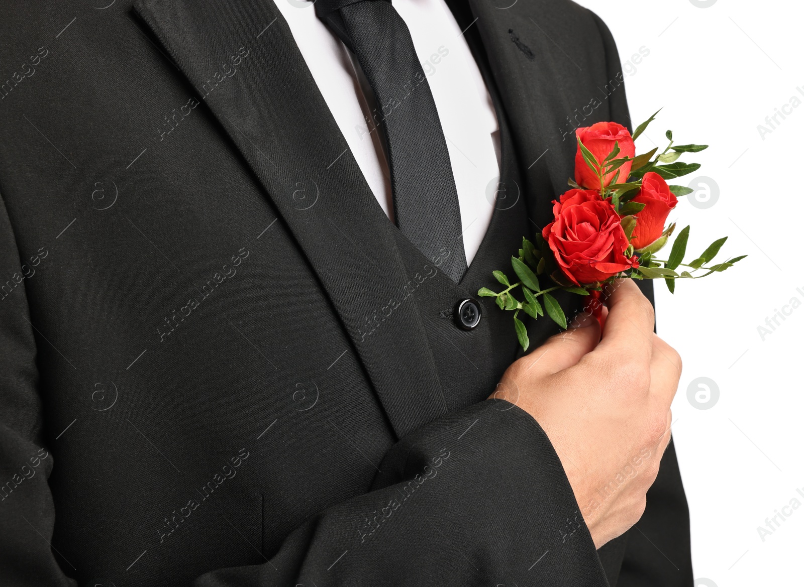 Photo of Groom in suit with stylish boutonniere on white background, closeup