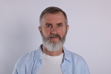 Portrait of senior man on white background