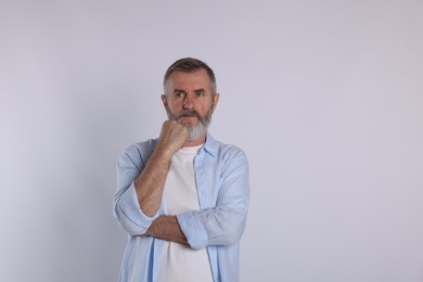 Portrait of senior man on white background