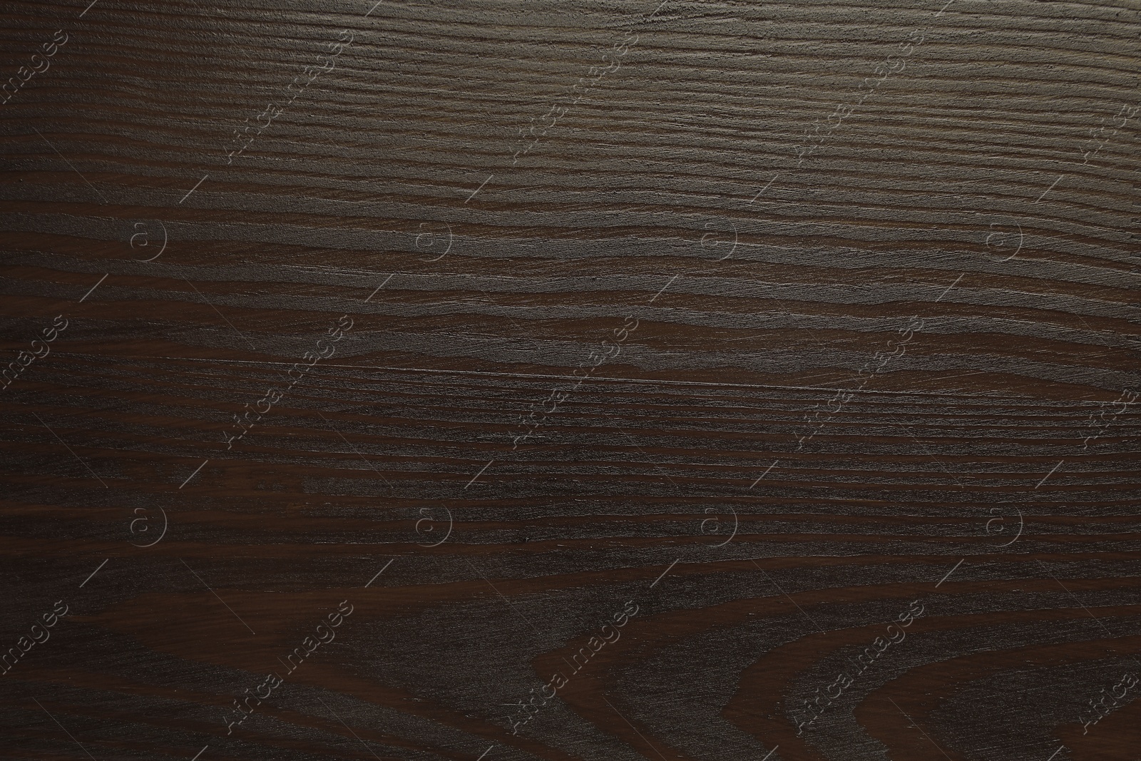 Photo of Texture of wooden surface after applying walnut wood stain as background, top view