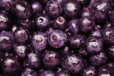 Photo of Wet acai berries as background, closeup view