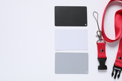 Photo of White balance calibration cards on white background, top view