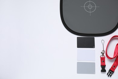 Photo of White balance calibration cards on white background, top view