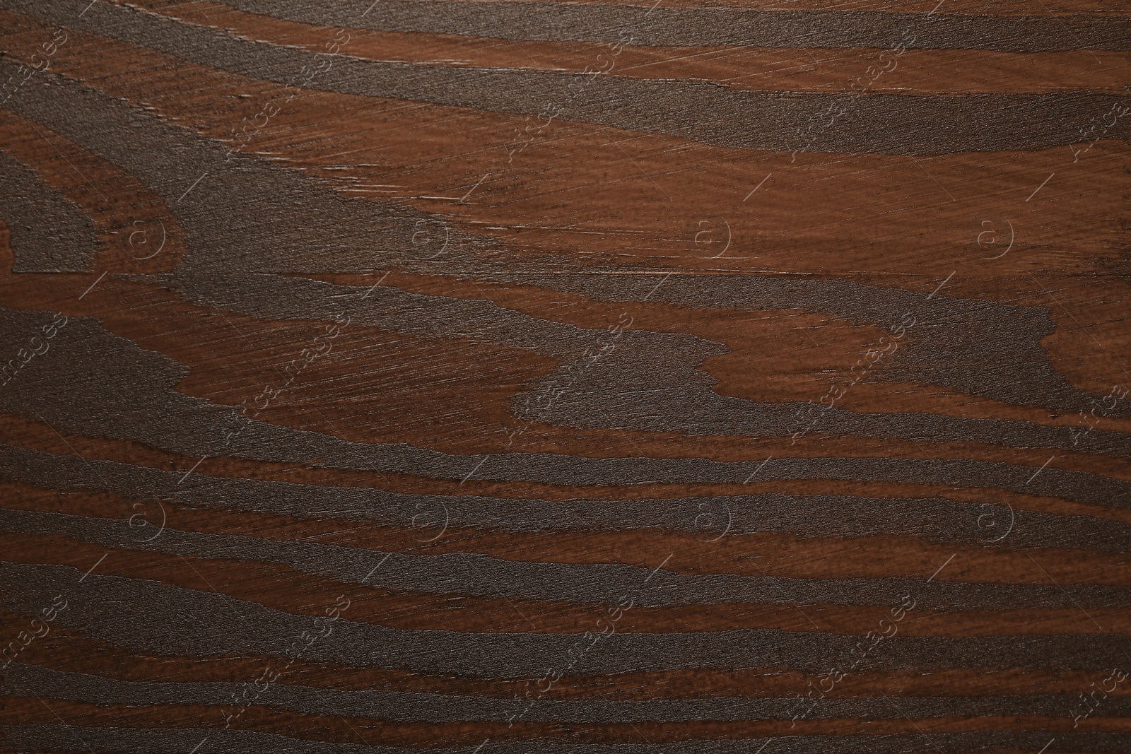 Photo of Texture of wooden surface after applying walnut wood stain as background, top view