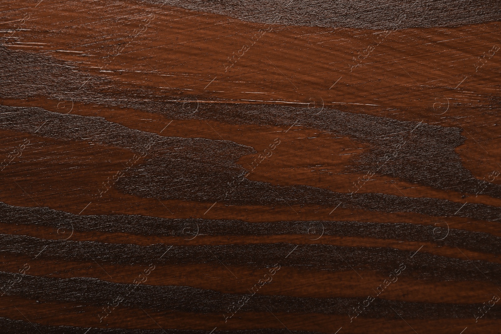 Photo of Texture of wooden surface after applying walnut wood stain as background, top view