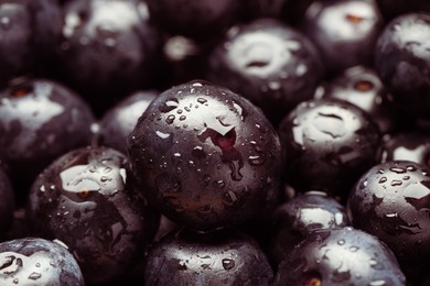 Photo of Wet acai berries as background, closeup view