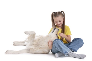 Girl with her cute Golden Retriever dog on white background