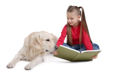 Photo of Girl with book and her cute Golden Retriever dog on white background