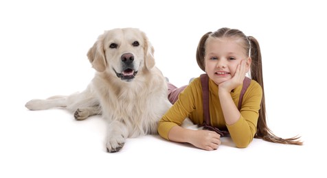 Girl with her cute Golden Retriever dog lying on white background