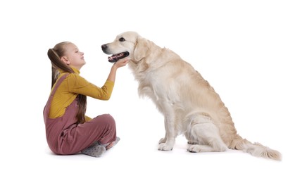 Girl with her cute Golden Retriever dog on white background