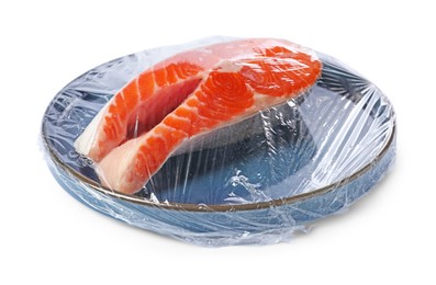 Plate of salmon with plastic food wrap isolated on white