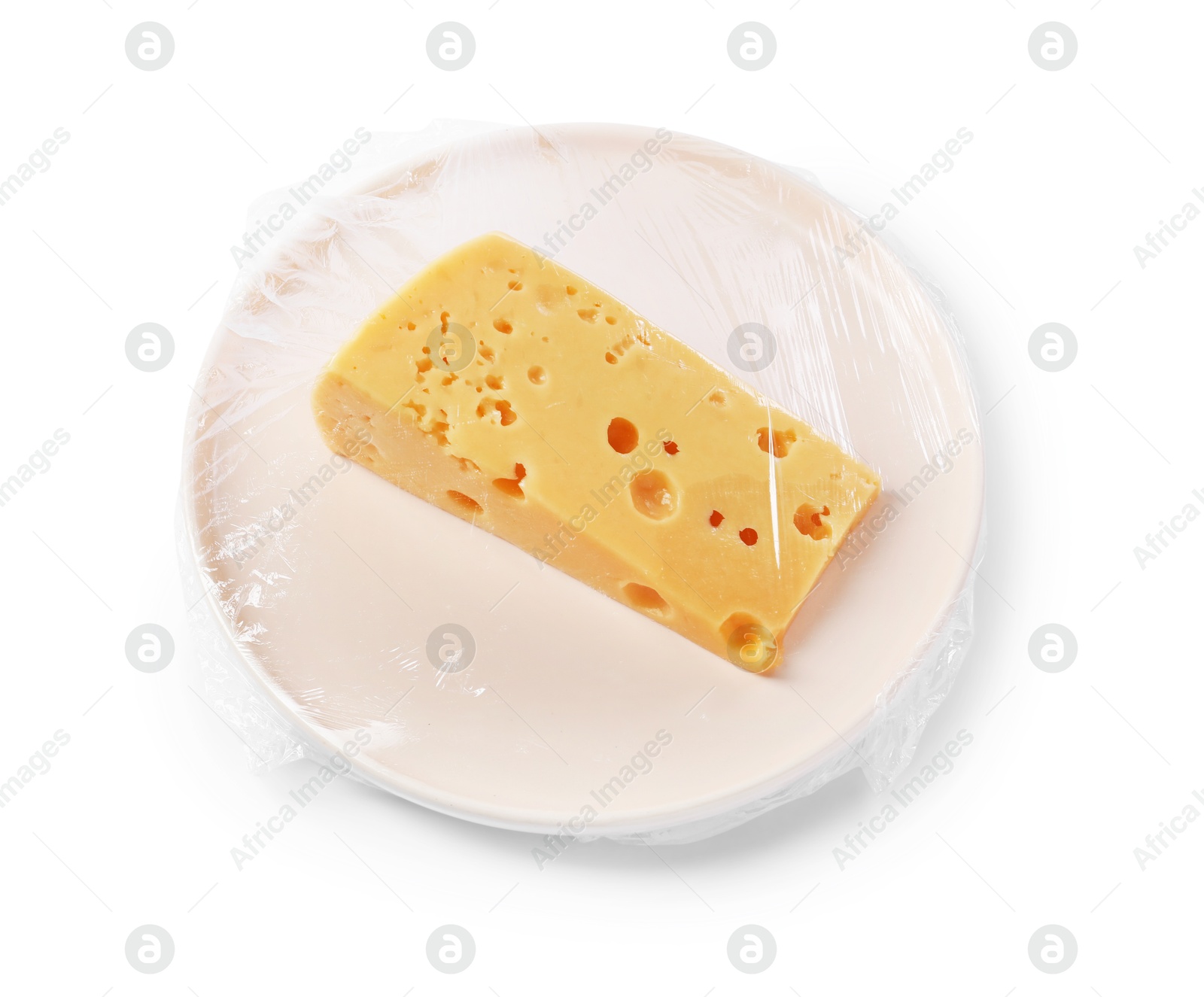 Photo of Plate of cheese with plastic food wrap isolated on white