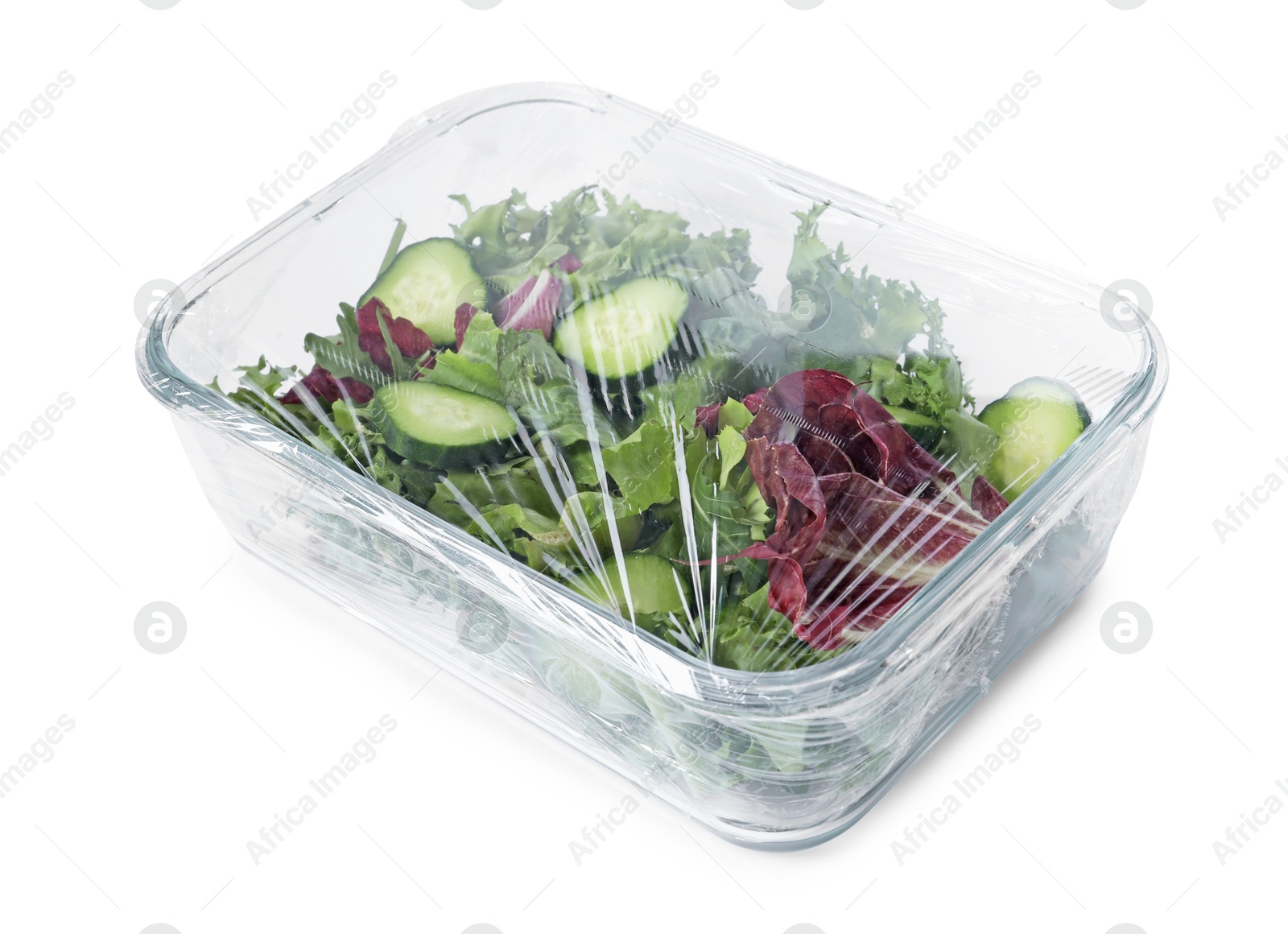 Photo of Glass container of fresh salad with plastic food wrap isolated on white