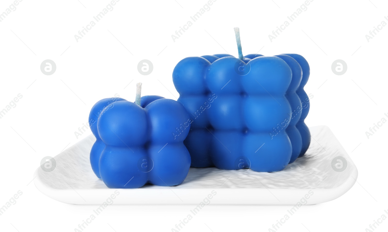 Photo of Two blue bubble candles isolated on white