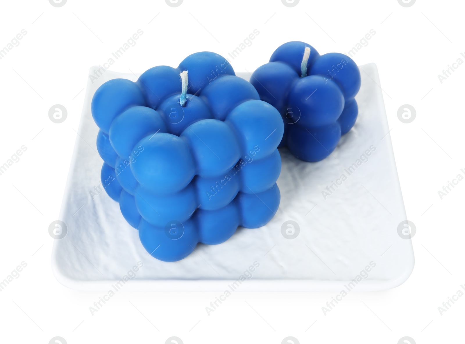 Photo of Two blue bubble candles isolated on white