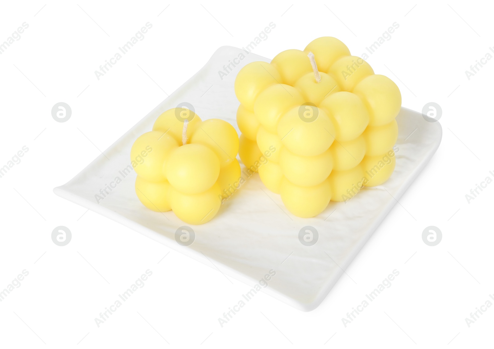 Photo of Two yellow bubble candles isolated on white