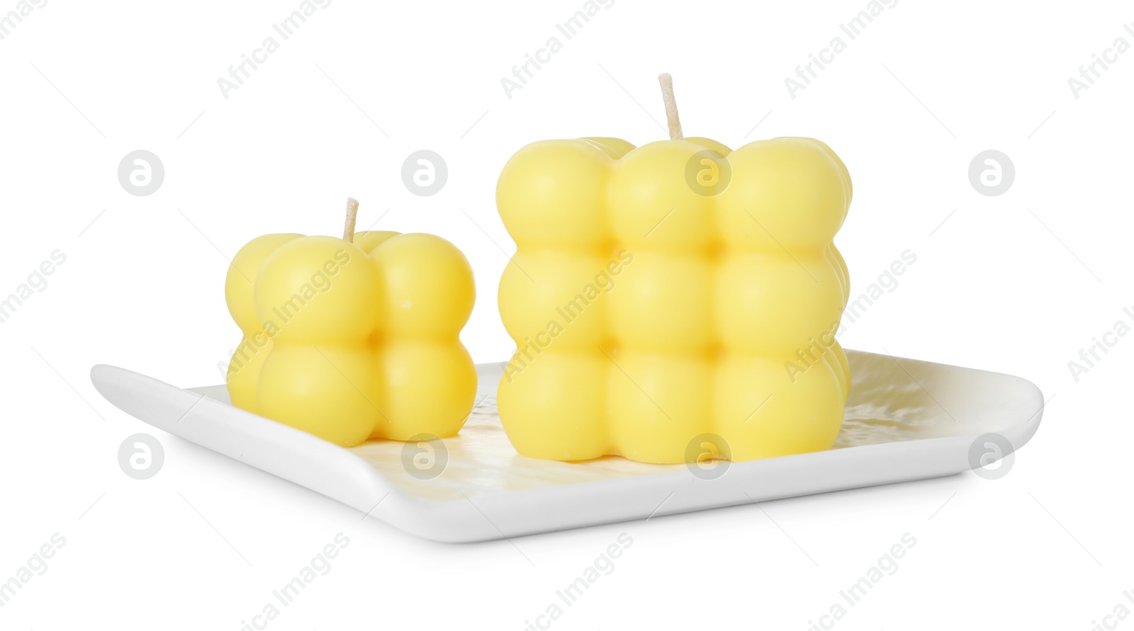 Photo of Two yellow bubble candles isolated on white