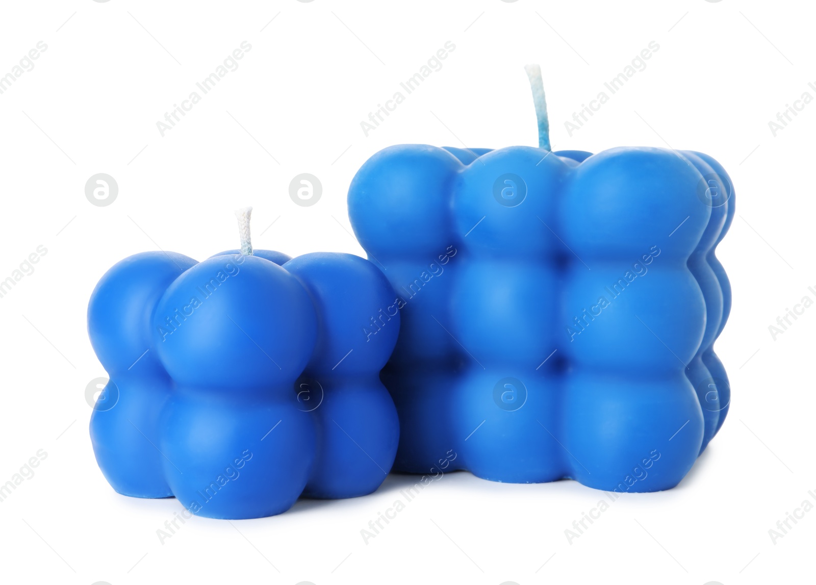 Photo of Two blue bubble candles isolated on white